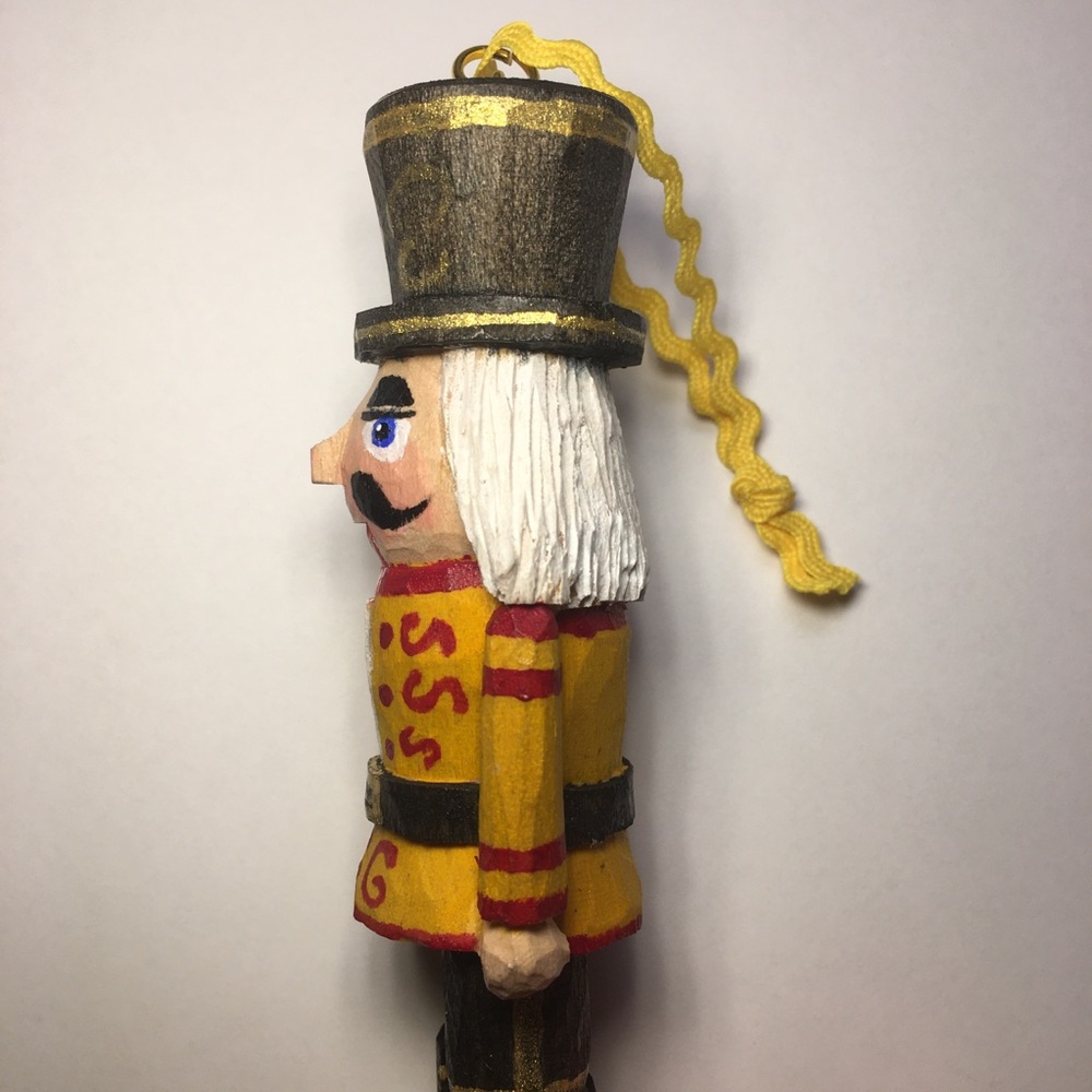 Hand Carved Yellow and Red Nutcracker Ornament - Picture 3 of 3